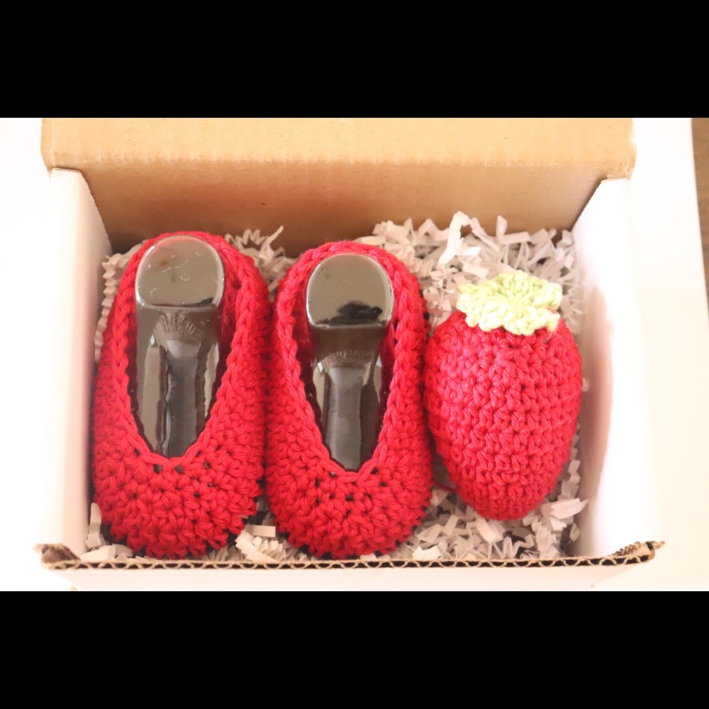 100% Cotton deep red new born - 6 months baby shoes and a strawberry rattle.